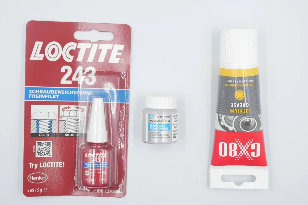 Loctite, vaseline and lithium grease laying on the table